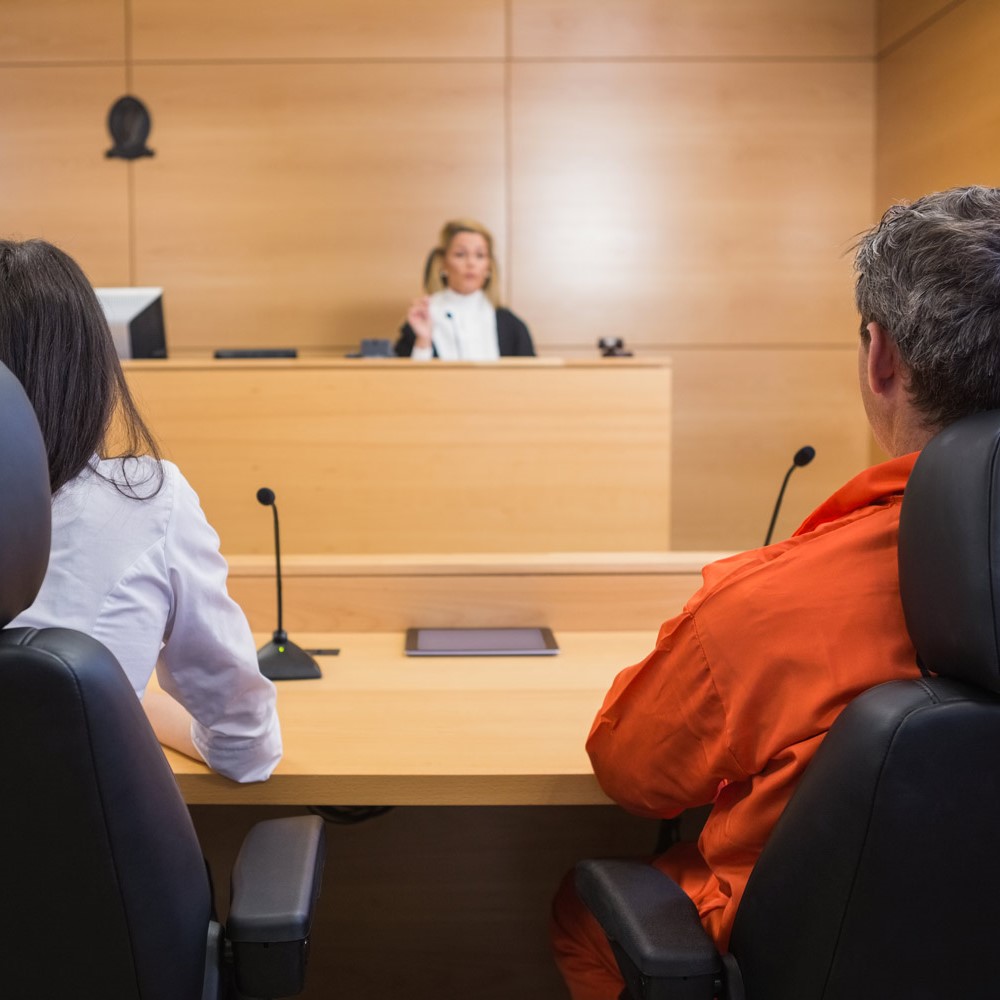 Lawyer and client listening to judge